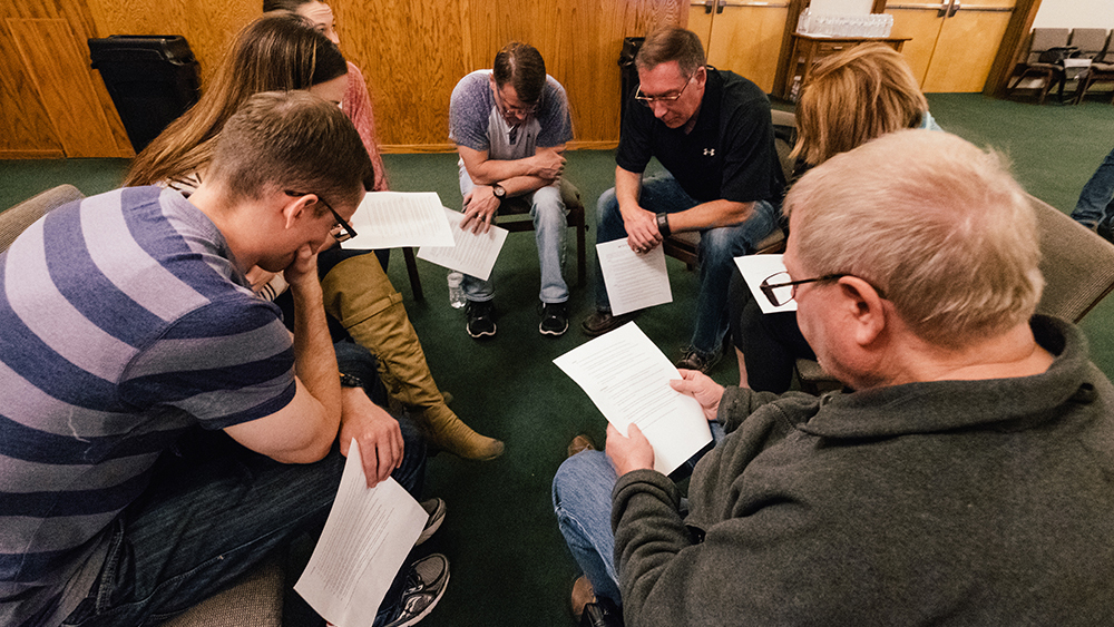 group of people praying